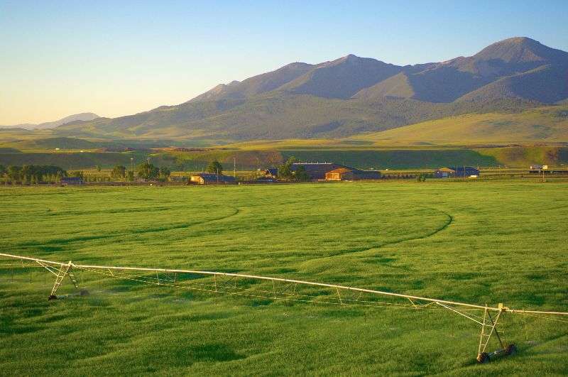 Pivot with mountains in the background on a Montana ranch for sale