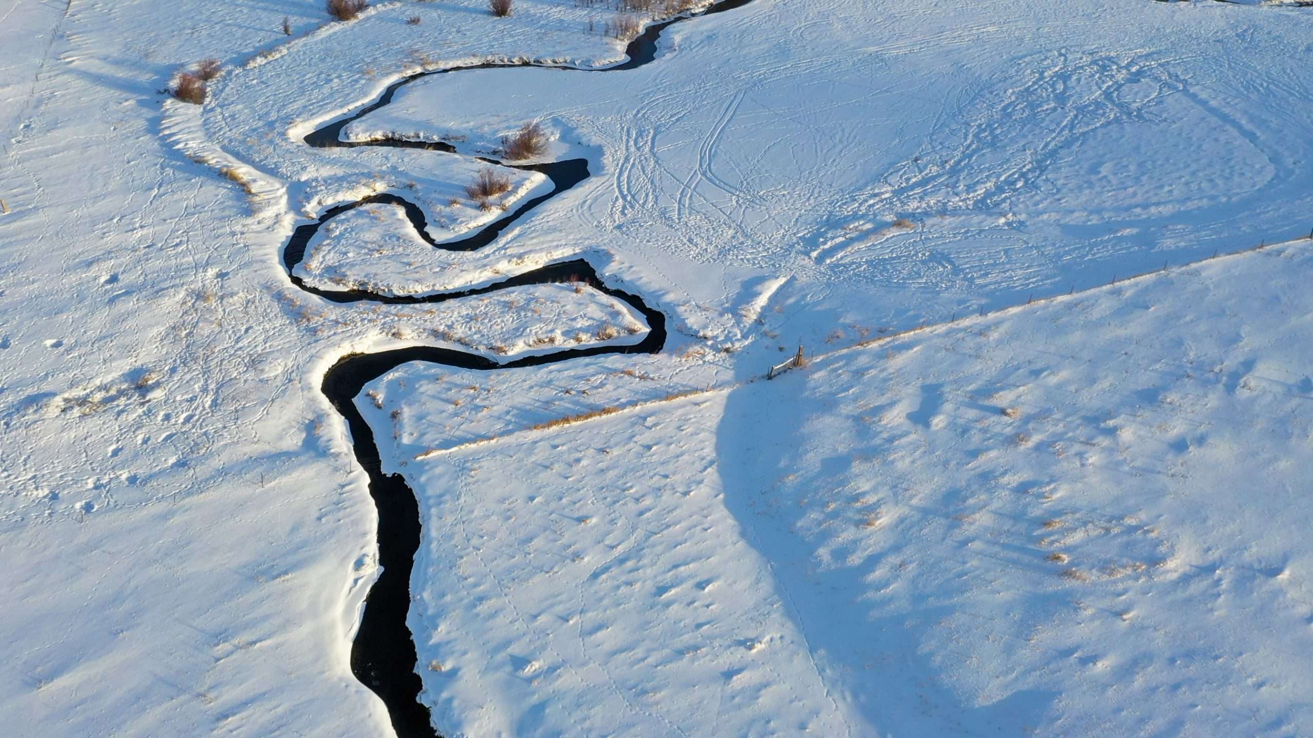 Aerial view of creek on Montana ranch for sale Snowshoe Creek Homestead